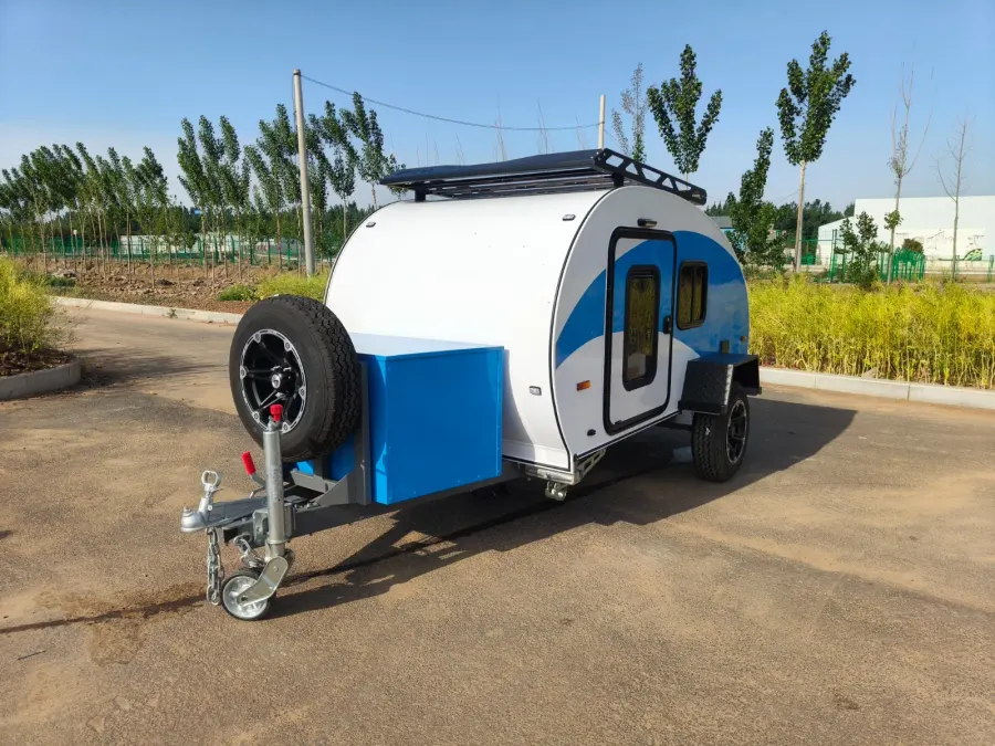 Breath Plus in white and blue with drawbar-mounted spare wheel and blue front toolbox
