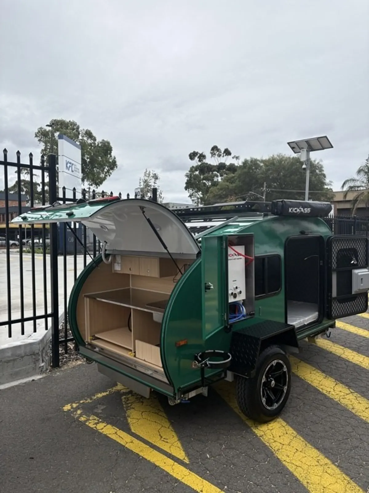 Green Plus with kitchen hatch and drawers open at the workshop