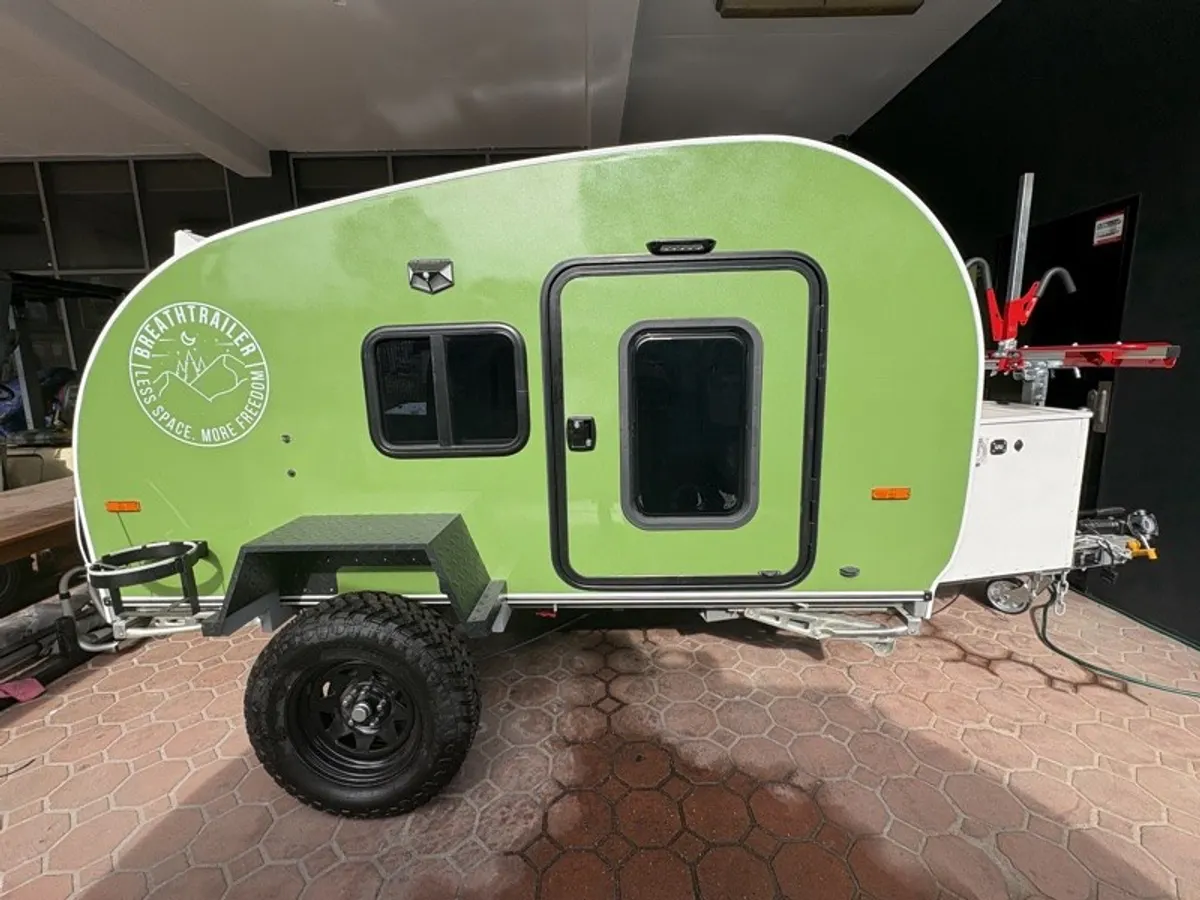 Lime green Ultra side profile with off-road wheels