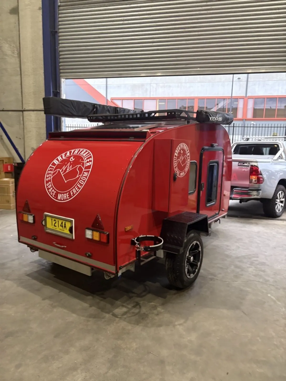 Red Ultra rear exterior with roof-mounted awning