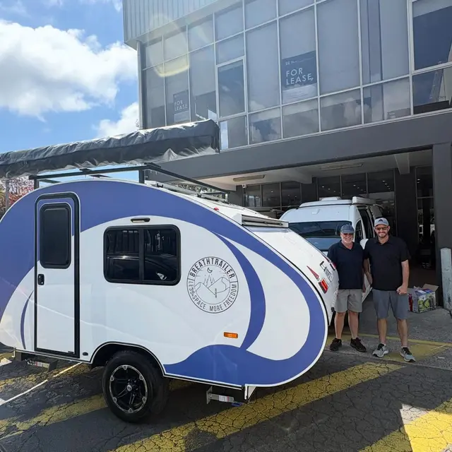 Marcus with their Breath Trailer at handover
