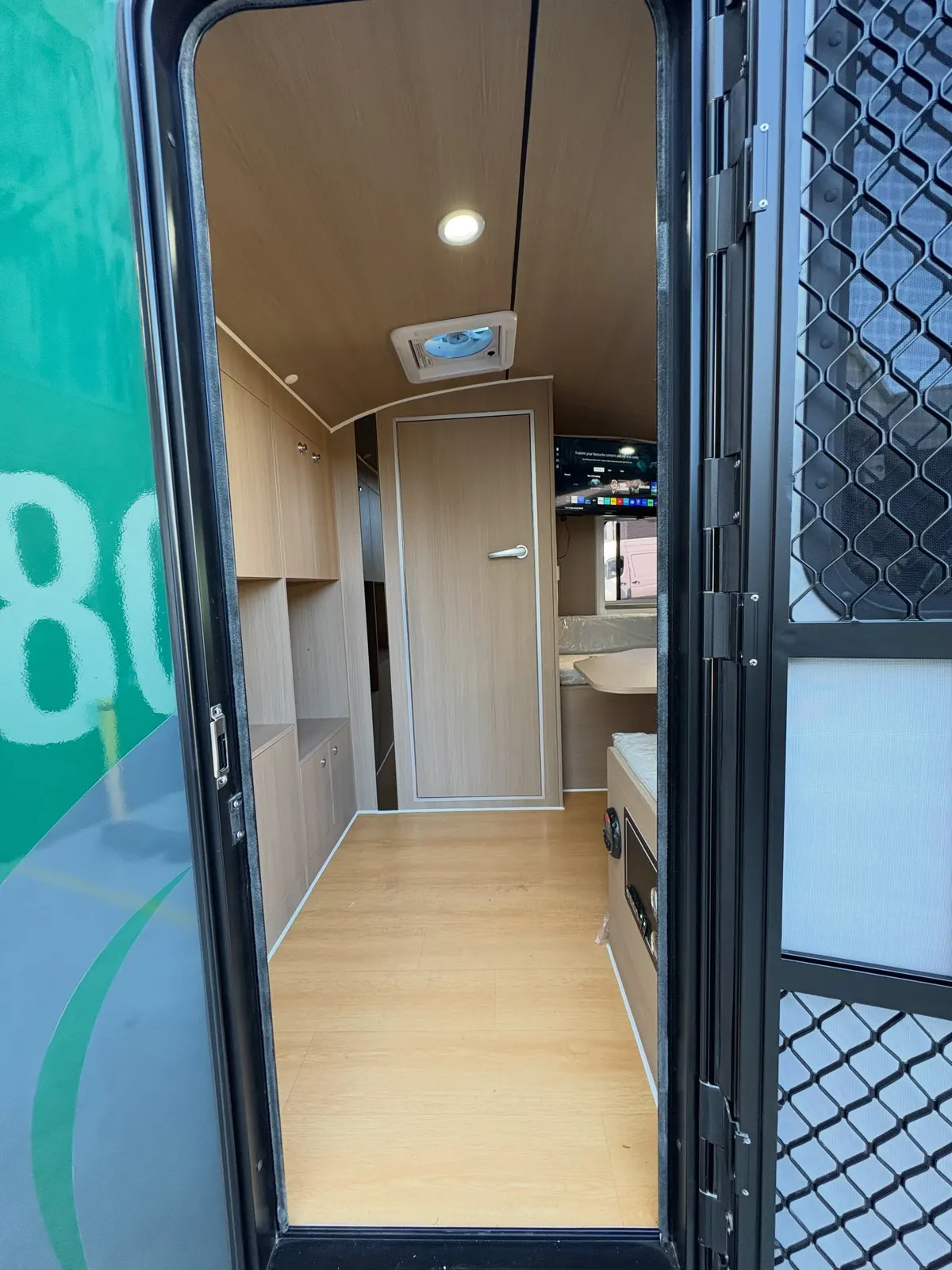 View through Max full-height doorway towards the fitted wardrobe