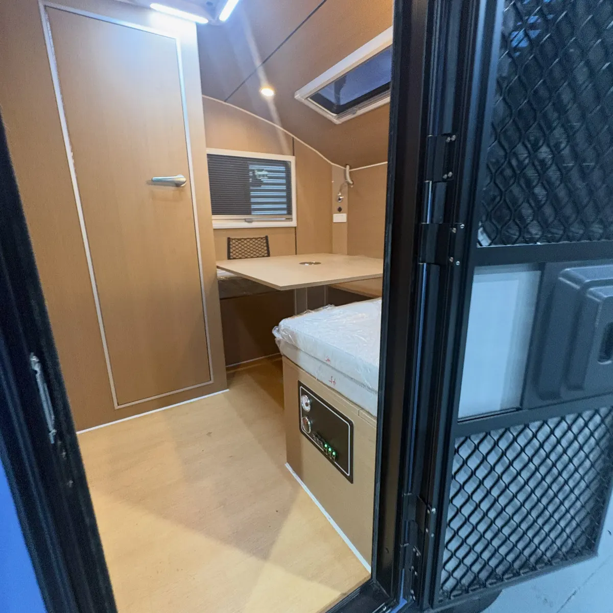 Blue Max tall entrance with bed and fitted storage inside