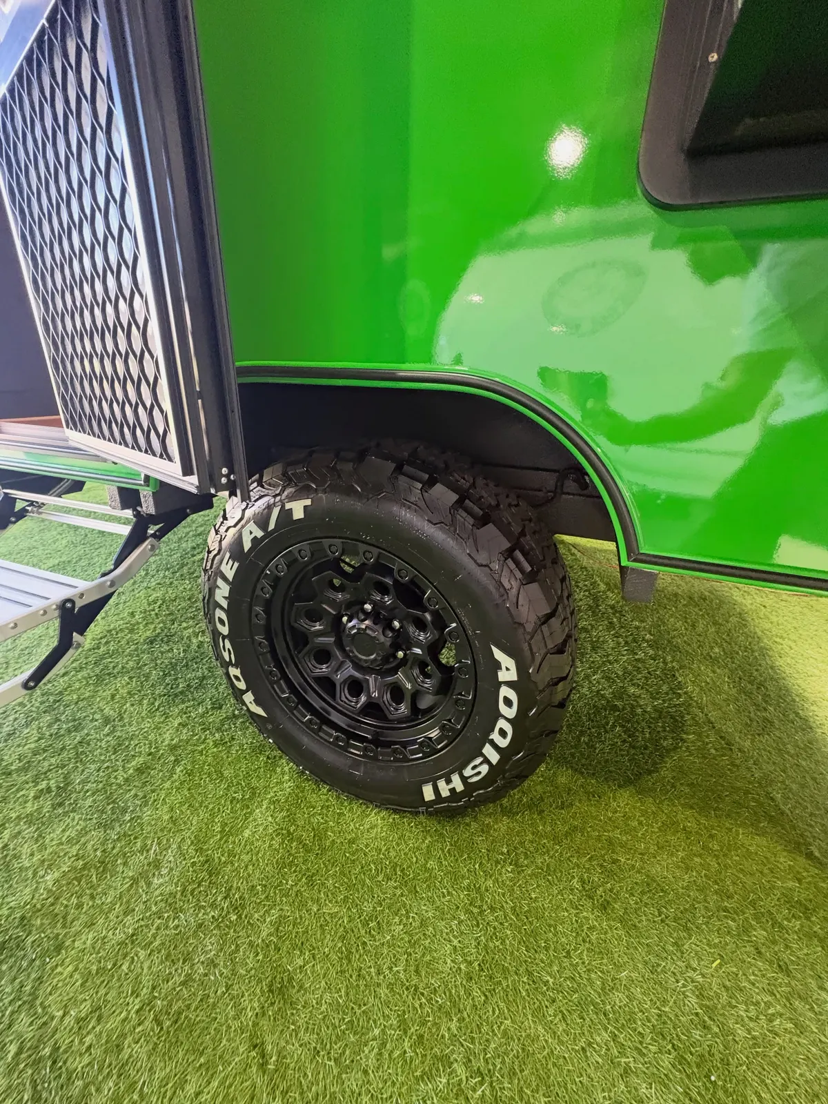 Current green Max off-road wheel, tyre and exterior body detail