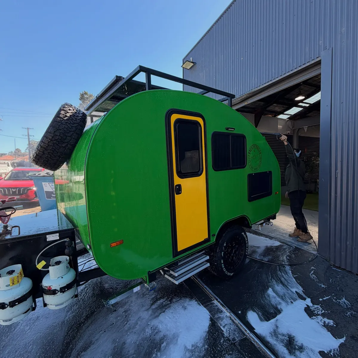 Green current Max with yellow door, roof rack and off-road wheels
