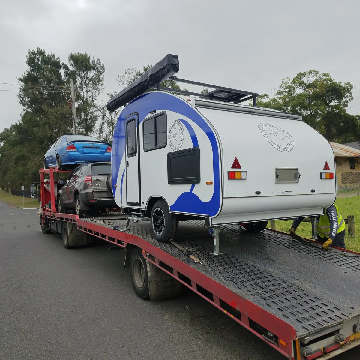 Tony’s white and blue Max being transported to Queensland