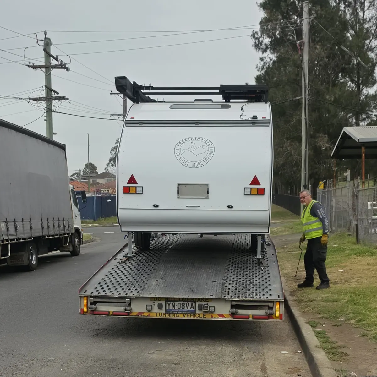 Rear of Tony’s Max on its delivery truck with roof rack and awning