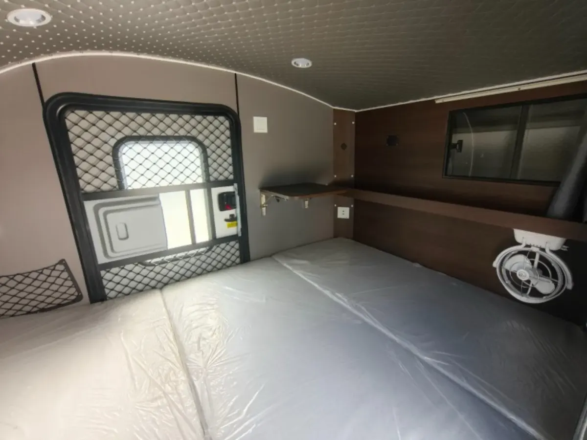 Plus sleeping cabin with mattress, overhead cupboards, fan and security mesh door