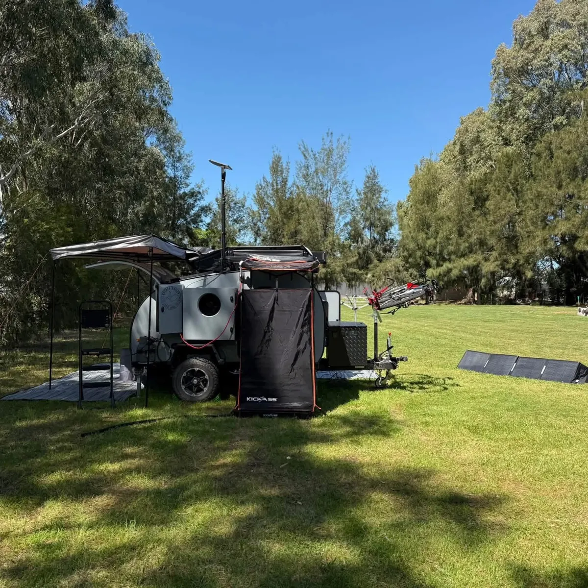 Ultra at camp with optional shower tent and awning