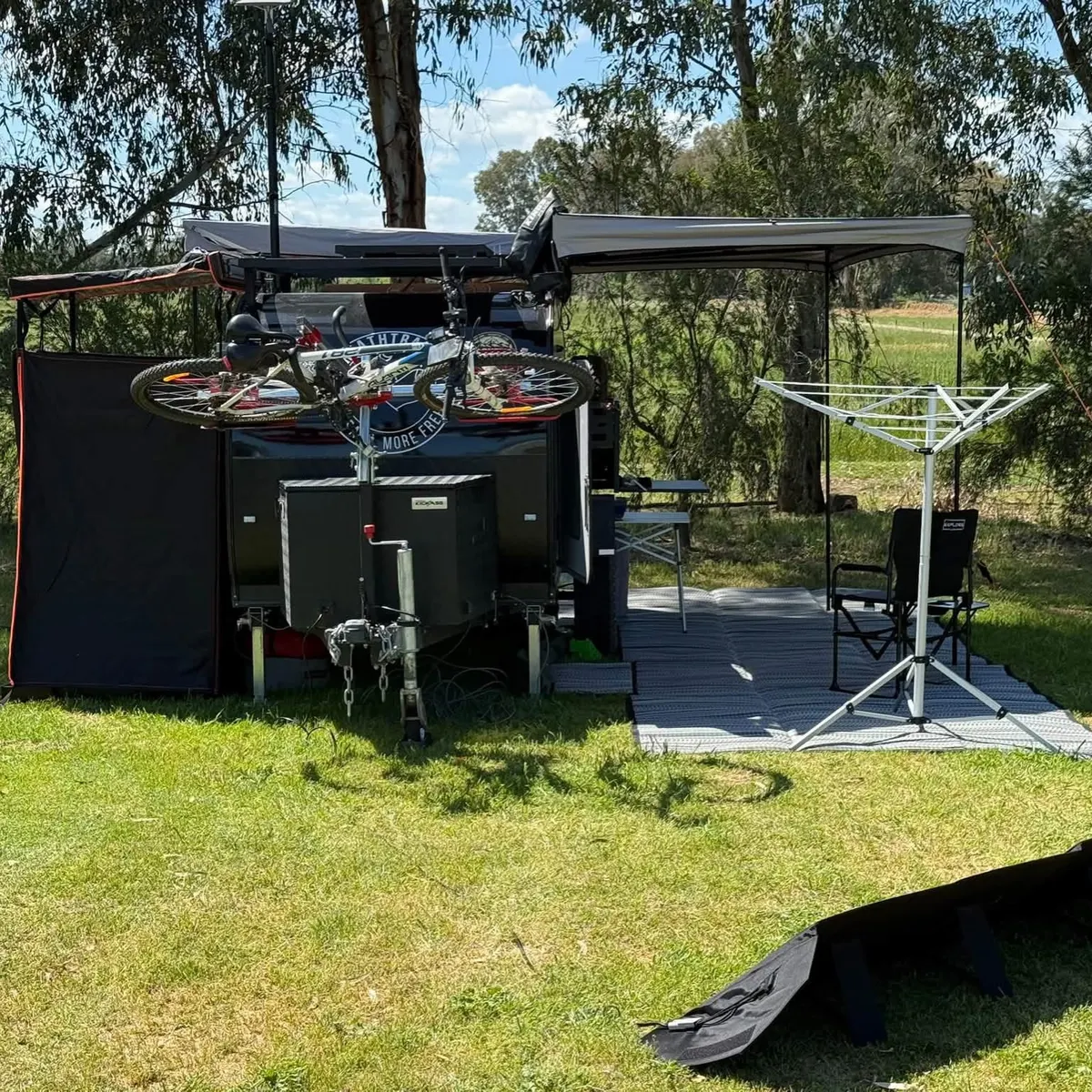 Ultra at camp carrying bikes on its optional rack