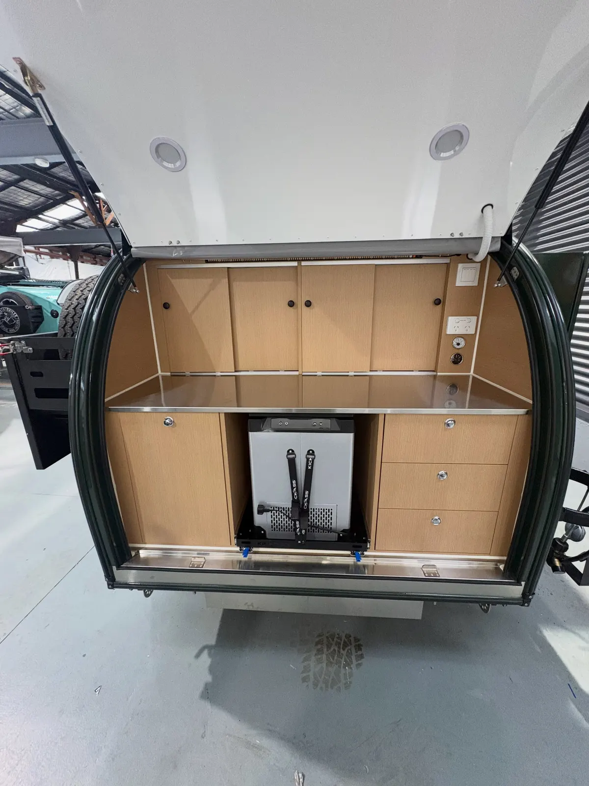 Green Ultra rear kitchen with bench and drawers closed