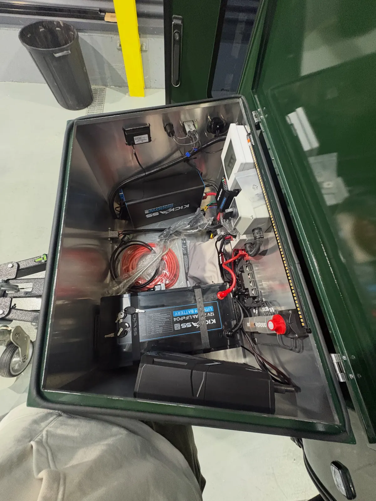 Open battery box in a completed Ultra, showing its battery system, charger, electrical controls and lighting