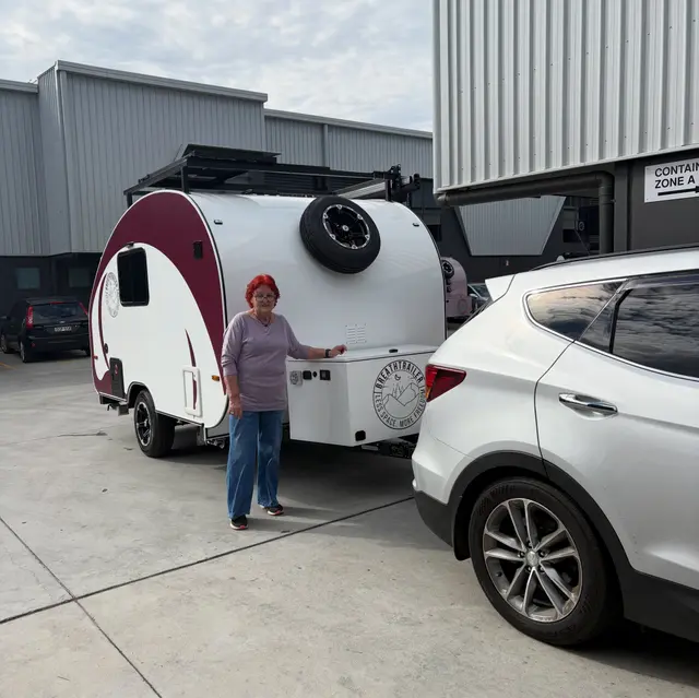 Wini with their Breath Trailer at handover
